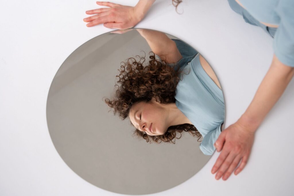 A photo of a woman posing in front of a mirror 